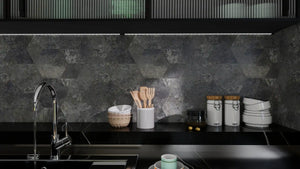 Modern kitchen with dark stone backsplash and countertop