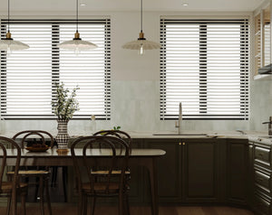 Modern kitchen with Colamo Cumulus White subway tiles in a vertical stacked pattern, creating a soft off-white backsplash under natural window light.