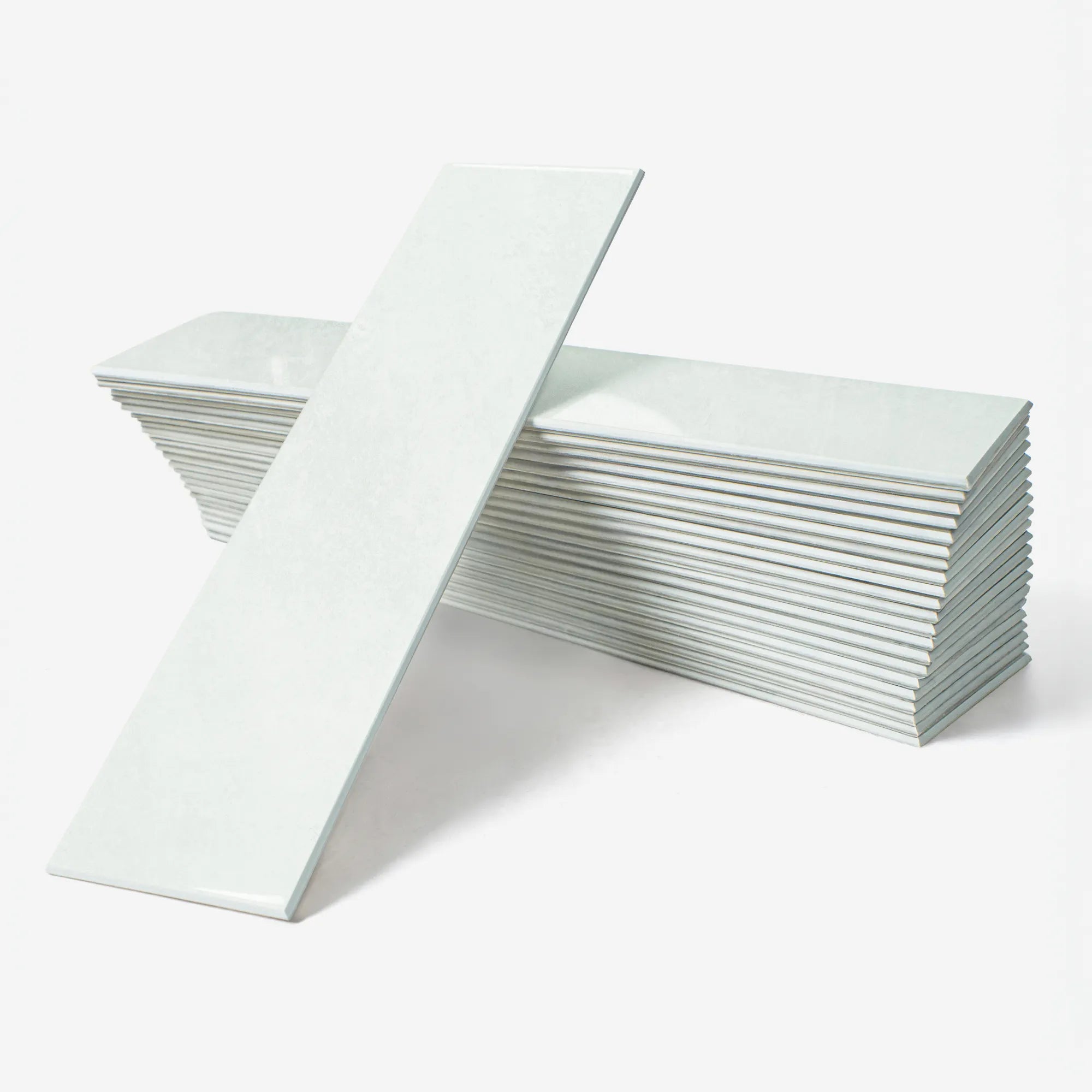 Colamo premium glossy Cumulus White subway peel and stick tile, soft off-white rectangular wall tile for a sophisticated kitchen or bathroom DIY project.