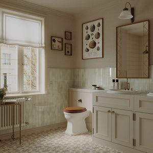 Elegant bathroom vanity featuring Colamo Sand Beige subway glossy peel and stick tiles, warm neutral vertical stacked wall decor for a cozy DIY renovation.