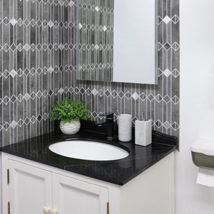 Gray mid-century geometric peel and stick backsplash tile in a modern bathroom vanity with black countertop and white cabinets