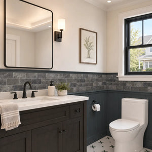Charcoal gray stone peel and stick tiles installed on a modern bathroom wall.