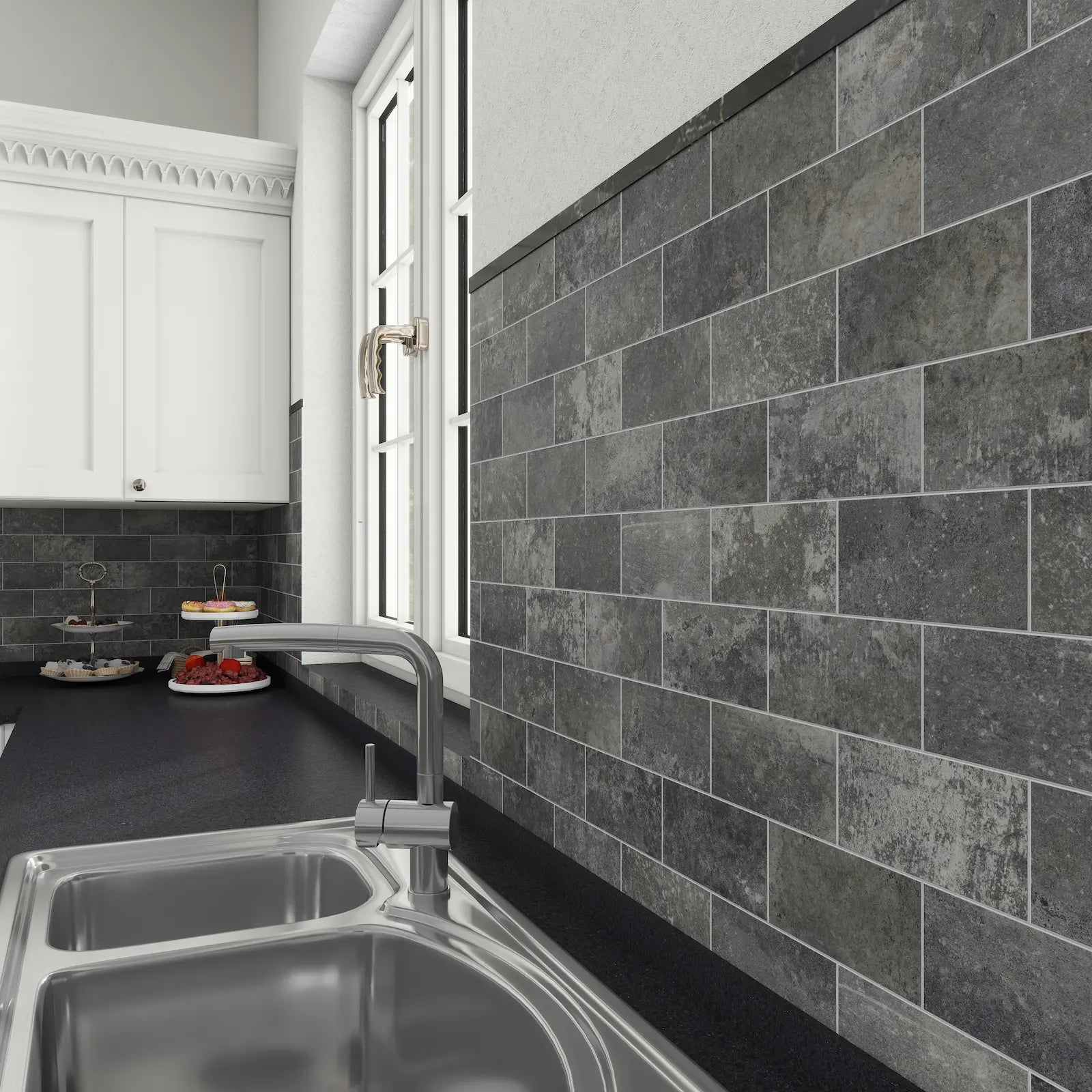 Charcoal gray stone peel and stick tiles installed as a kitchen backsplash.