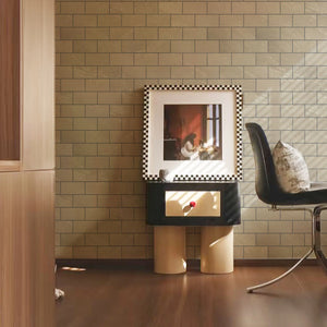 Colamo Luxury Subway Peel & Stick Tile in Beige Travertine with Dark Grout, shown as a sophisticated accent wall in a modern living space.