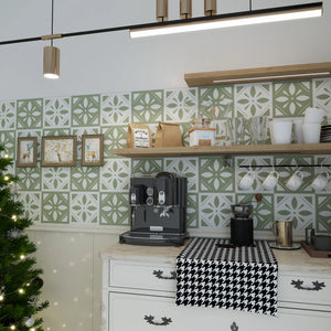 Sage green floral peel and stick tiles installed as a coffee bar backsplash.
