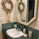 Peel and Stick tiles, Bathroom vanity with sink, mirror, and decorative elements.